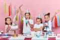 Frowning serious little girl isn`t being satisfied with birthday party