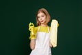 frowning woman cleaner apron with cleaning rag and detergent sprayer