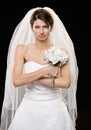 Frowning young bride in wedding dress and veil