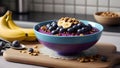 Frozen acai in a bowl served with granola and banana on rustic cutting board