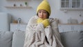 Frozen Asian Chinese Korean woman sick sad girl freezing sit in cold apartment suffer low temperature froze freeze Royalty Free Stock Photo