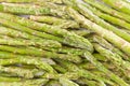 Frozen asparagus on white cutting board, top view, macro Royalty Free Stock Photo