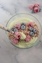 Frozen avocado smoothie bowl with frozen berries Royalty Free Stock Photo
