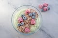 Frozen avocado smoothie bowl with frozen berries Royalty Free Stock Photo