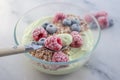 Frozen avocado smoothie bowl with frozen berries Royalty Free Stock Photo