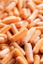 Frozen baby carrot vegetable. Mini orange carrots