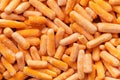 Frozen baby carrot vegetable. Mini orange carrots