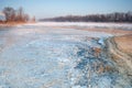 Frozen bank of a misty river in early morning Royalty Free Stock Photo