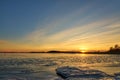 Frozen beach and icy sea on a sunset in Ruissalo, Finland. Royalty Free Stock Photo