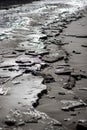 A frozen beach, partially covered by ice at the Baltic Sea coast