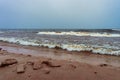 Frozen beach and winter waves