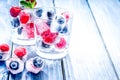 Frozen berries in glass for cocktail on wooden table background Royalty Free Stock Photo