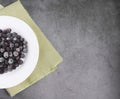 Frozen berries on a white plate close-up. flatlay. Copyspace