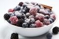 Frozen berry close-up on clean white background - fresh and juicy food photography