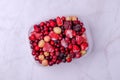 Frozen berry mix in a plastic container Royalty Free Stock Photo