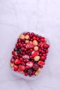 Frozen berry mix in a plastic container Royalty Free Stock Photo