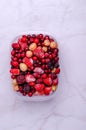 Frozen berry mix in a plastic container Royalty Free Stock Photo