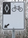 Frozen bicycle lane sign afeter a freezing rain storm Royalty Free Stock Photo