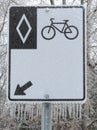 Frozen bicycle lane sign afeter a freezing rain storm