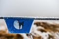 Frozen blue sign in the mountain