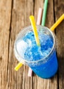 Frozen Blue Slushie in Plastic Cup with Straw