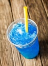 Frozen Blue Slushie in Plastic Cup with Straw