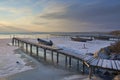 frozen boat in winter on the lake at sunrise Royalty Free Stock Photo