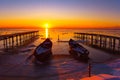 frozen boat in winter on the lake at sunrise Royalty Free Stock Photo