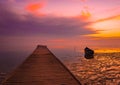 frozen boat in winter on the lake at sunrise