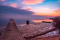 frozen boat in winter on the lake at sunrise Royalty Free Stock Photo