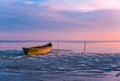 frozen boat in winter on the lake at sunrise Royalty Free Stock Photo