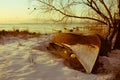 frozen boat in winter at sunrise 03