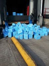 Frozen boxes of fish spilling onto loading bay