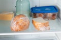 Frozen bread in the home refrigerator. The frozen products. Long food storage concept