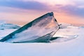 Frozen breaking ice close up in Baikal water lake