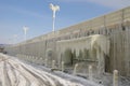 Frozen breakwater and bus stop after winter storm