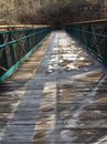 The frozen bridge leading into the woods