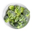 Frozen broccoli in bowl on white, top view. Vegetable preservation Royalty Free Stock Photo