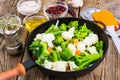 Frozen broccoli, brussels and cauliflower in frying pan Royalty Free Stock Photo