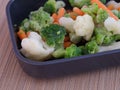 Frozen broccoli, cauliflower, and carrots in a tray Royalty Free Stock Photo