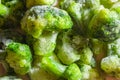 Frozen broccoli florets close-up. Vegetable preservation on the table Royalty Free Stock Photo