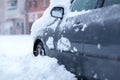 Frozen car covered snow at winter day Royalty Free Stock Photo