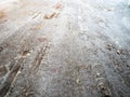 Frozen car tire tread imprints on slippery road