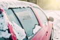 Frozen car window, car parked outside, winter transport Royalty Free Stock Photo