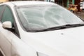 Frozen car windshield covered with ice and snow on a winter morning Royalty Free Stock Photo