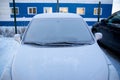 Frozen car, car windshield, glass covered with ice crusts, front view, snow, ice, Royalty Free Stock Photo