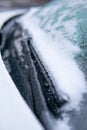 Frozen car winter driving Frosty patterns on a completely covered car Windshield Royalty Free Stock Photo