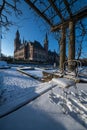 Frozen chair at the Peace Palace garden, Vredespaleis, under the Snow Royalty Free Stock Photo