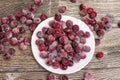 Frozen cherries on a wooden table Royalty Free Stock Photo