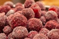 Frozen cherry fruit close up. Cherry in ice crystals